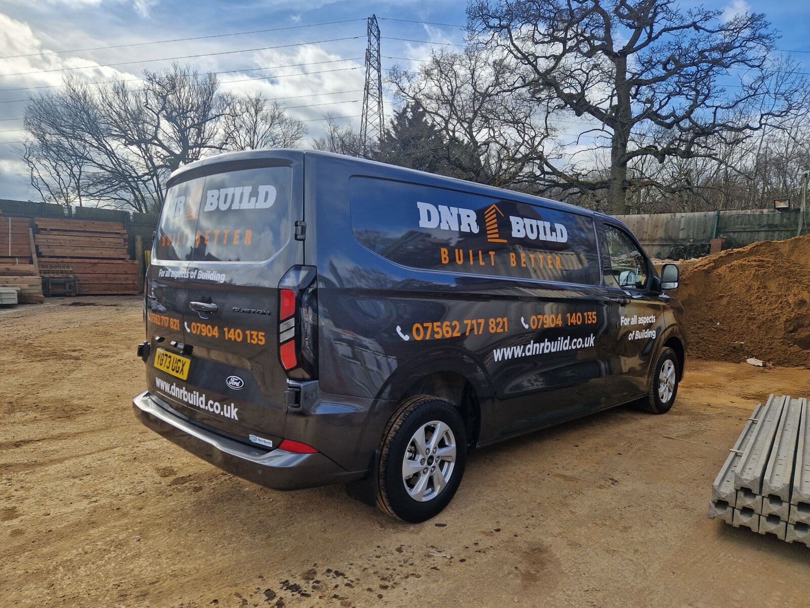 DNR Build branded van on site, with the Built Better strapline and contact details
