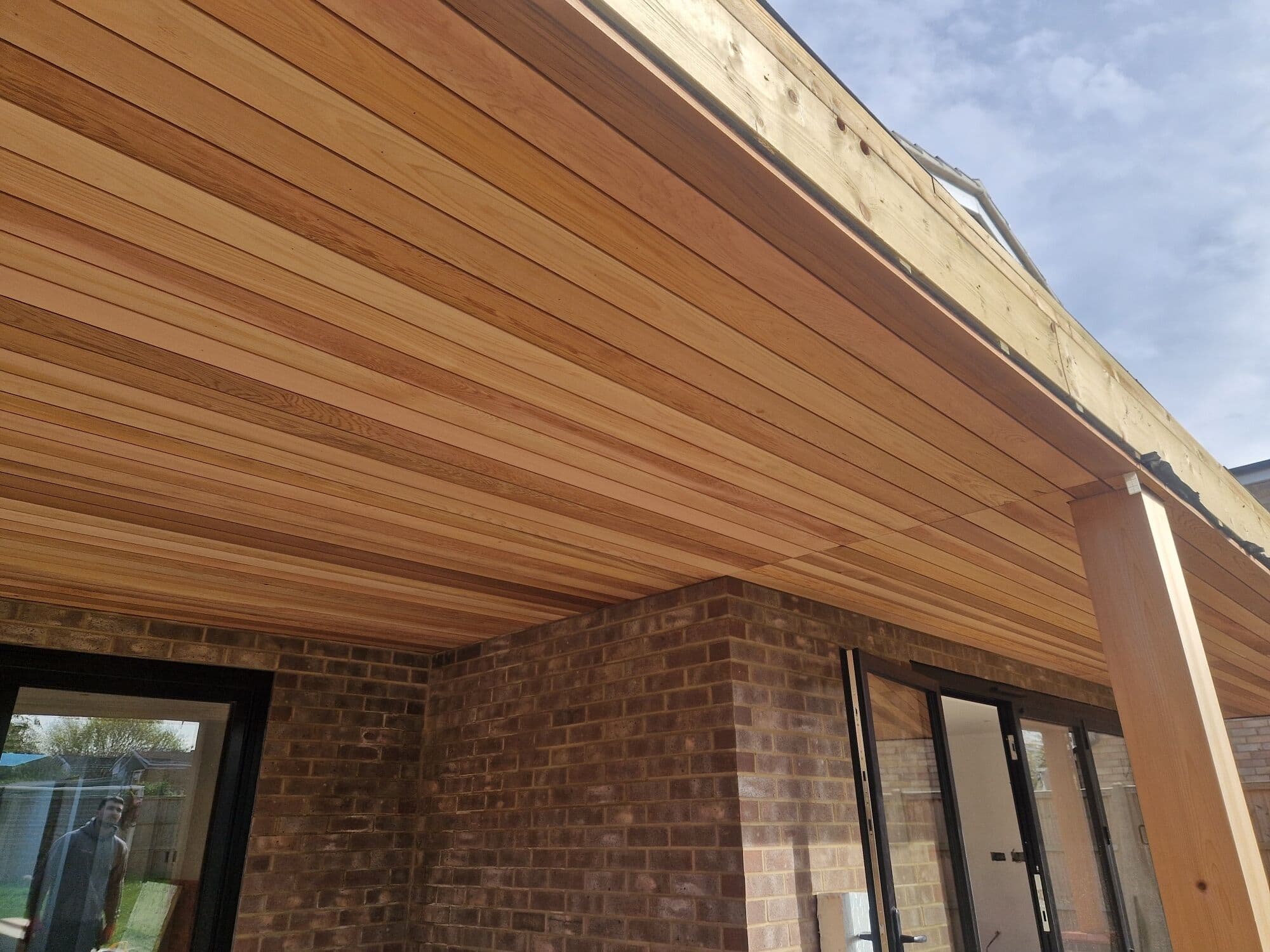 Cedar boards going up on the underside of the new canopy
