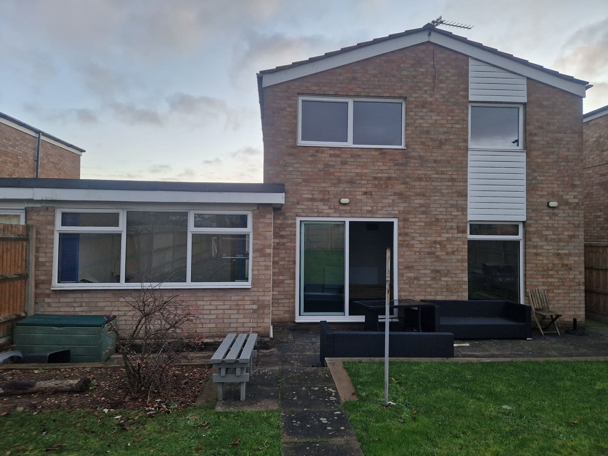 The back of the house as it was, with an old flat roofed single storey rear and white cladding
