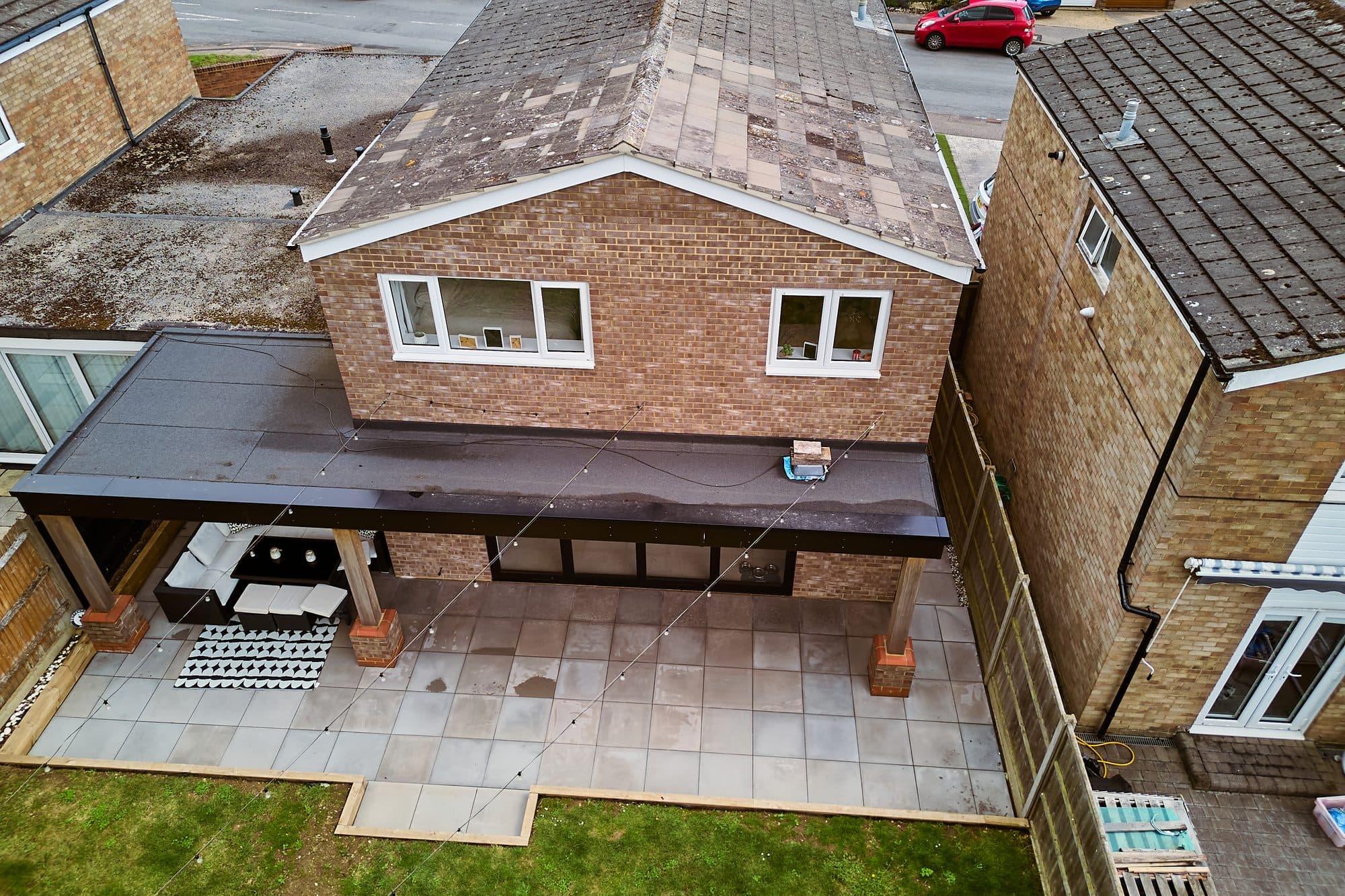 Drone view of the finished extension, canopy roof and patio by DNR Build