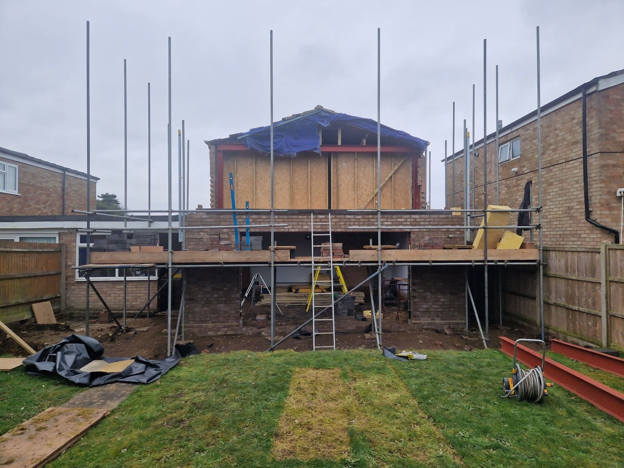 The rear of the house under scaffolding as the new double storey extension goes up