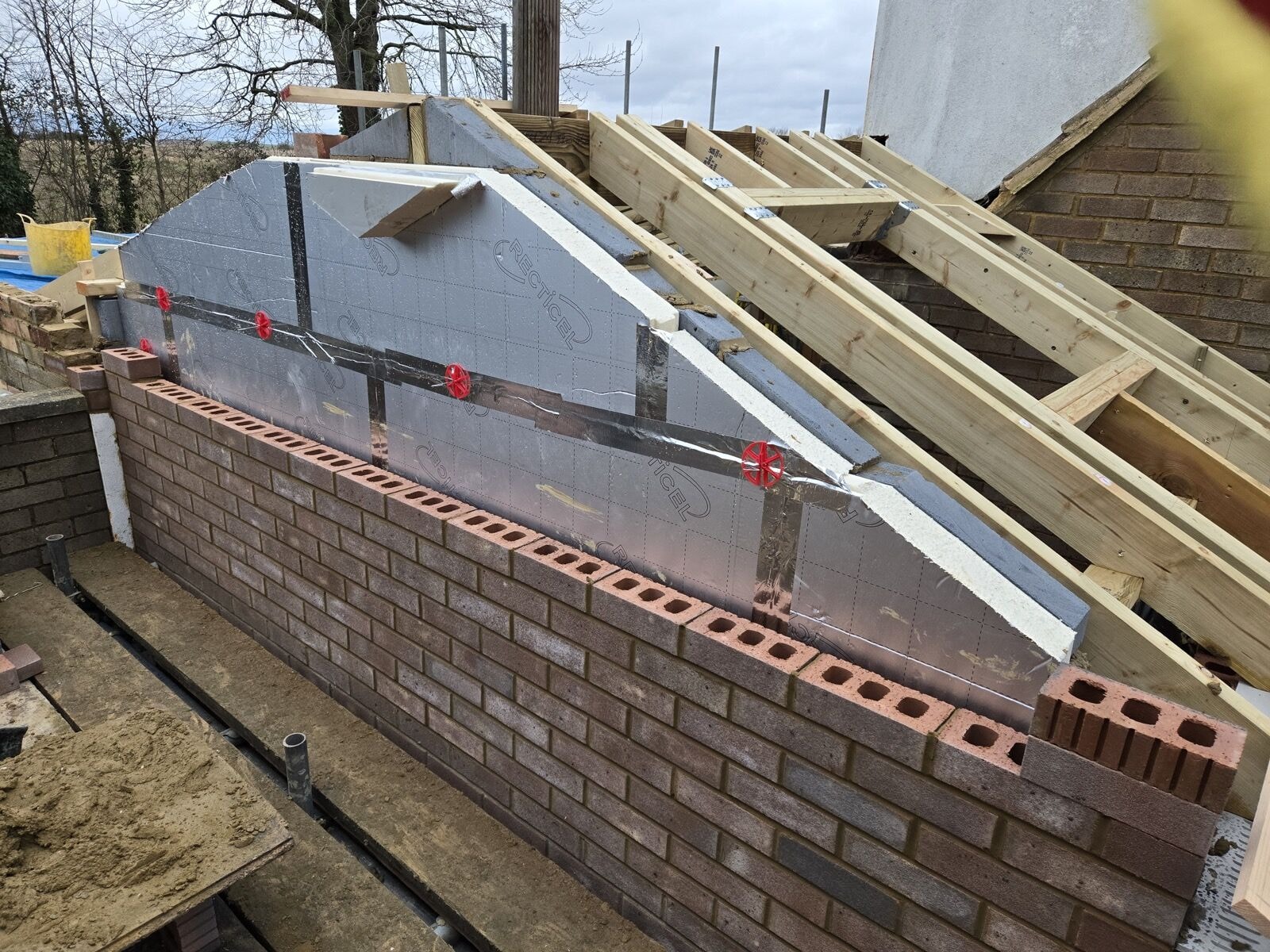 Insulated cavity and timber wall plate detail during the double storey extension build by DNR Build