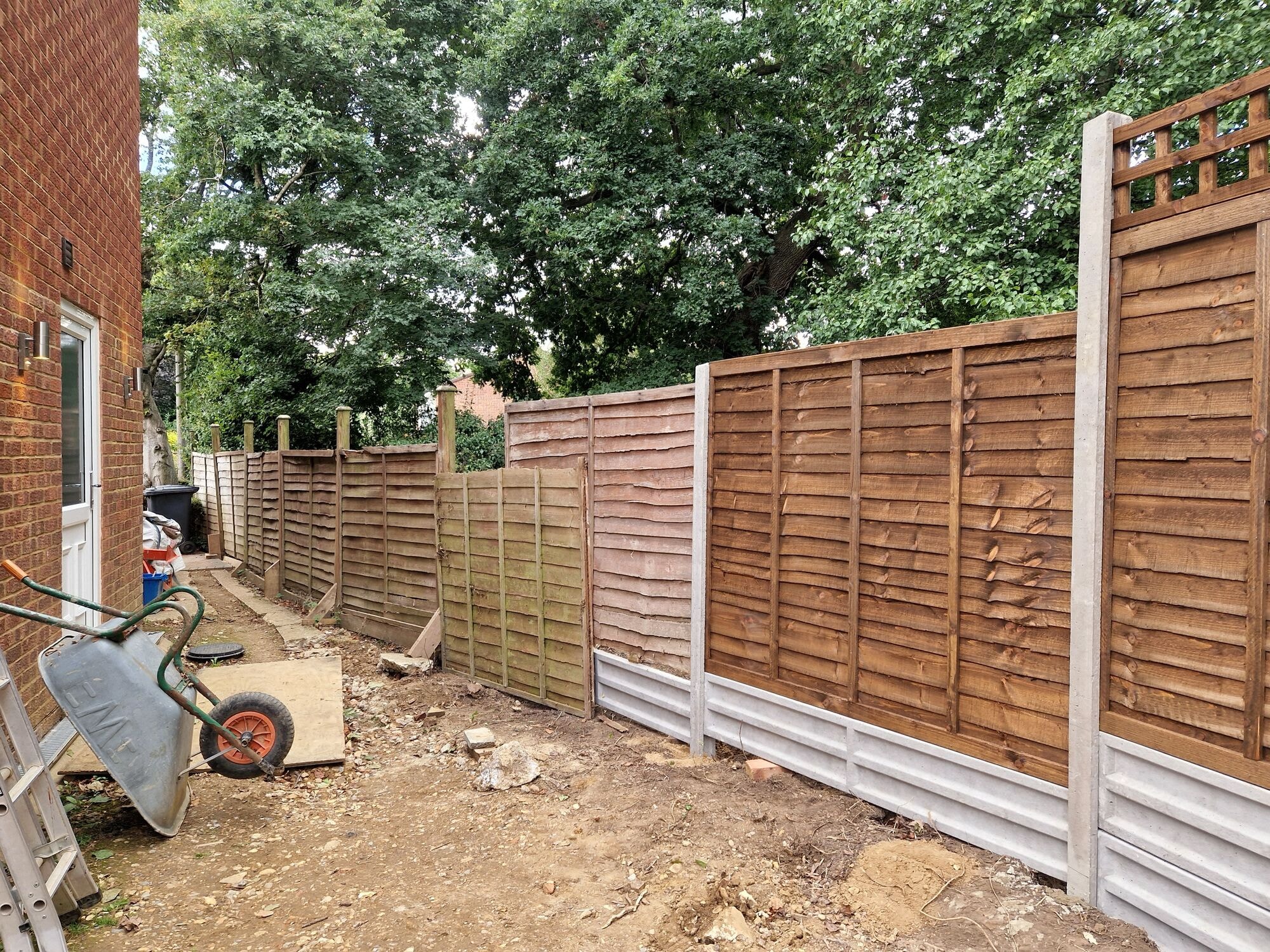 New close board fencing going up along the side access during the garden revamp by DNR Build