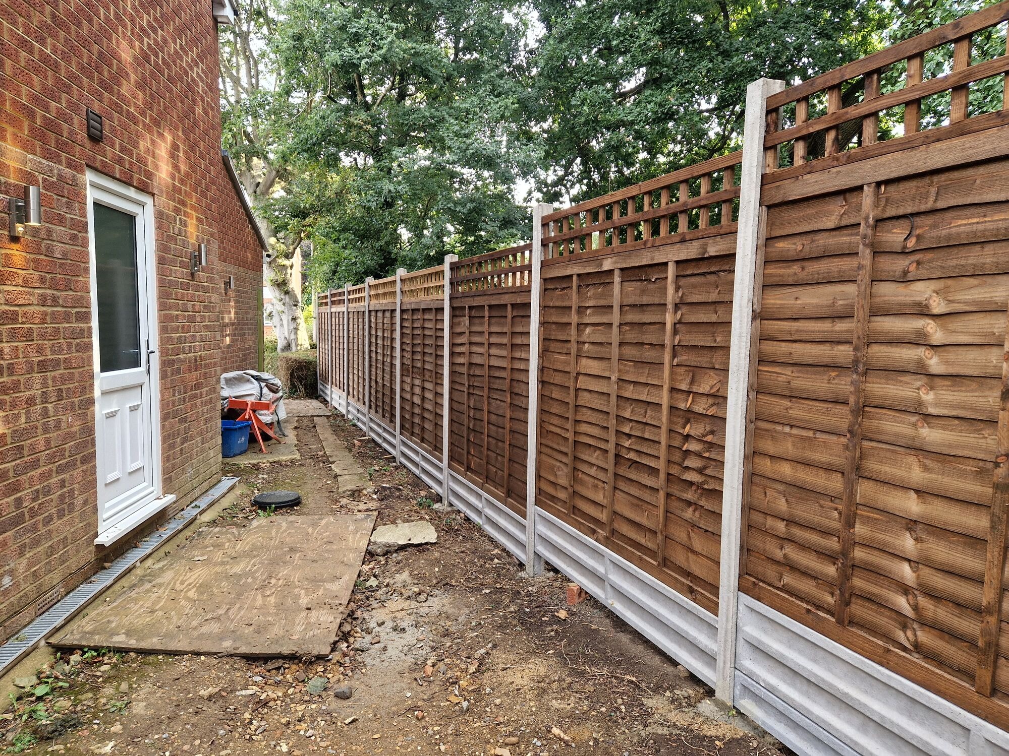 New close board fencing completed along the side access with the ground cleared by DNR Build