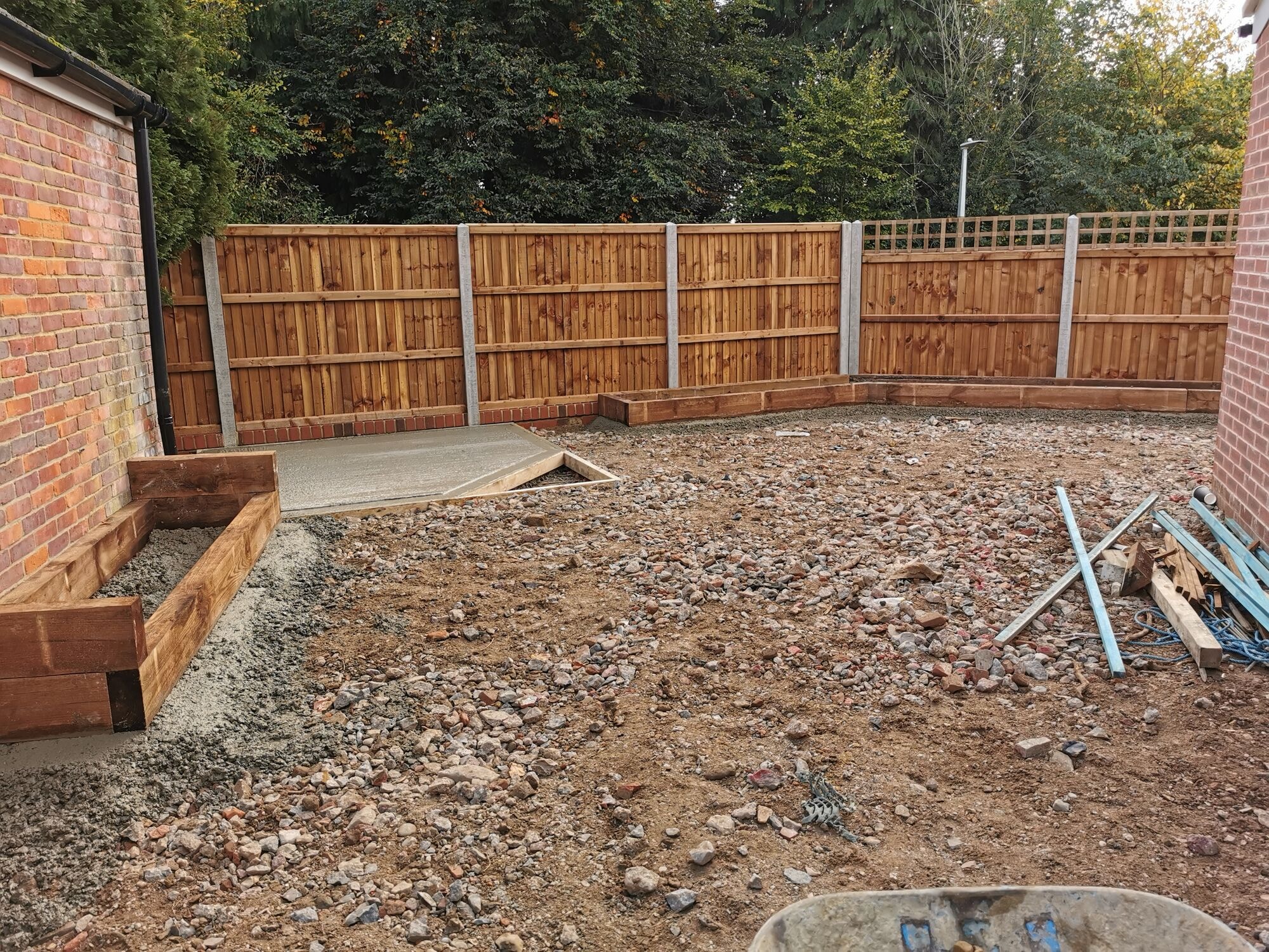 The garden cleared and prepared with new sleeper retaining beds and a concrete base by DNR Build