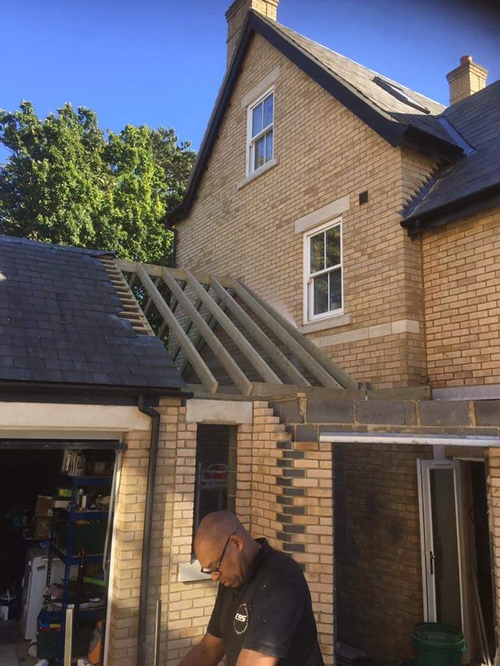 New timber roof structure being built over the single storey link during the conversion by DNR Build