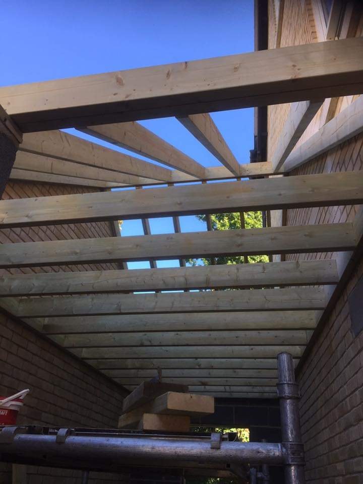 New timber rafters and joists framing the roof during the conversion by DNR Build