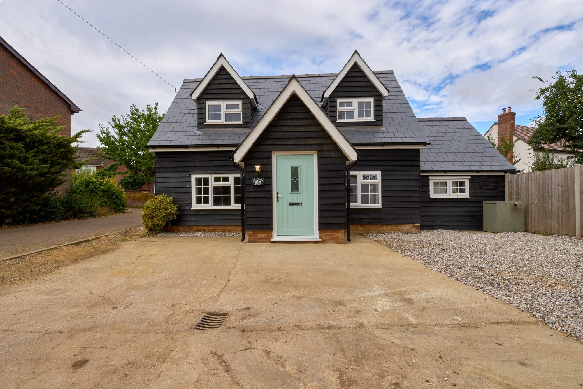 The finished exterior, roof and patio of the Old Timber Cottage in Stevenage by DNR Build (2 of 10)