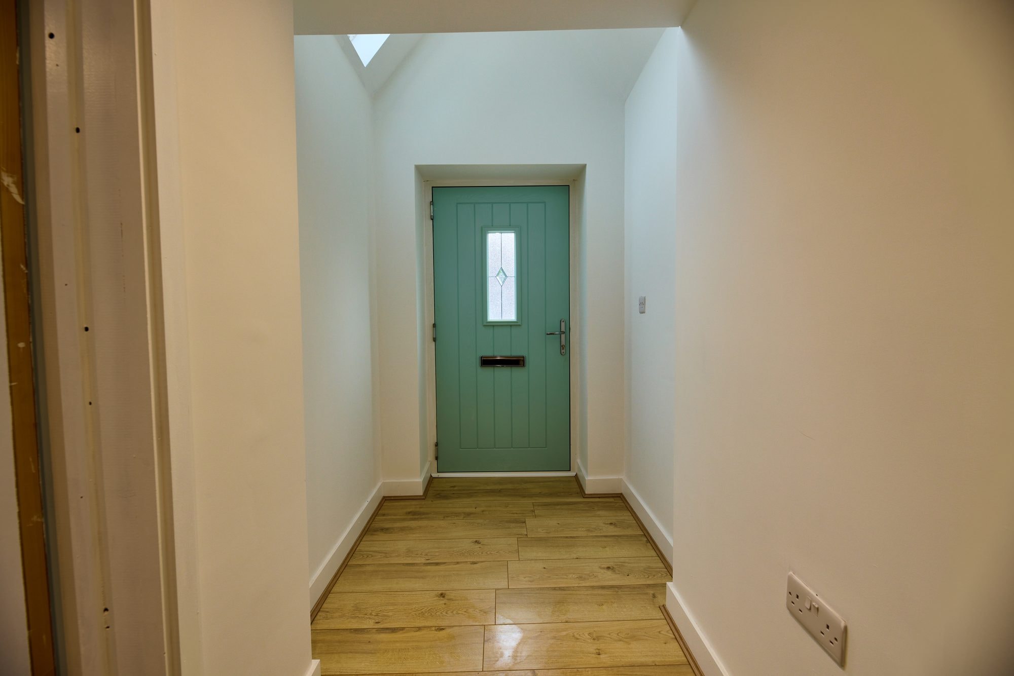 The renovated hallway, staircase and living rooms at the Old Timber Cottage in Stevenage by DNR Build (1 of 10)