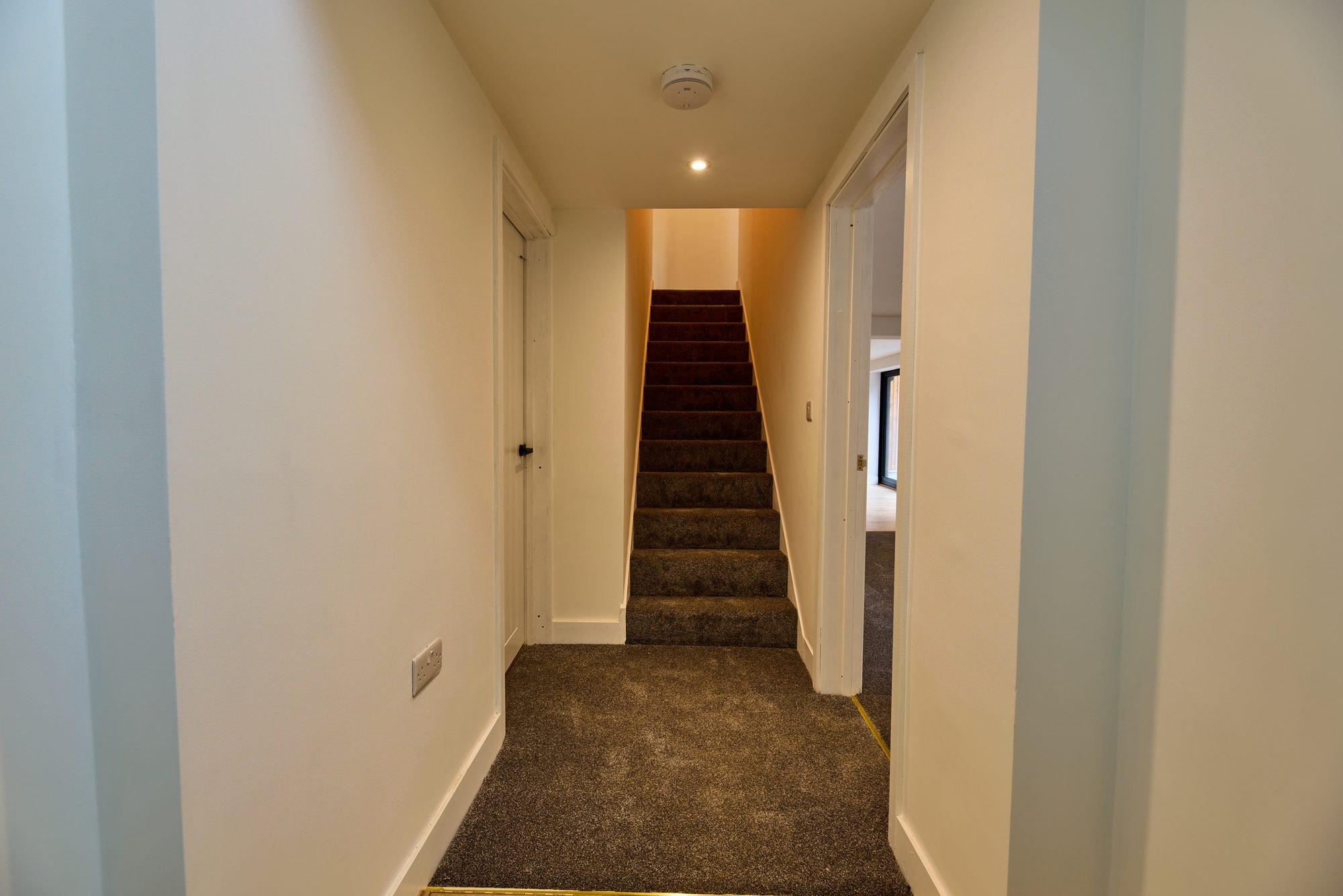 The renovated hallway, staircase and living rooms at the Old Timber Cottage in Stevenage by DNR Build (2 of 10)