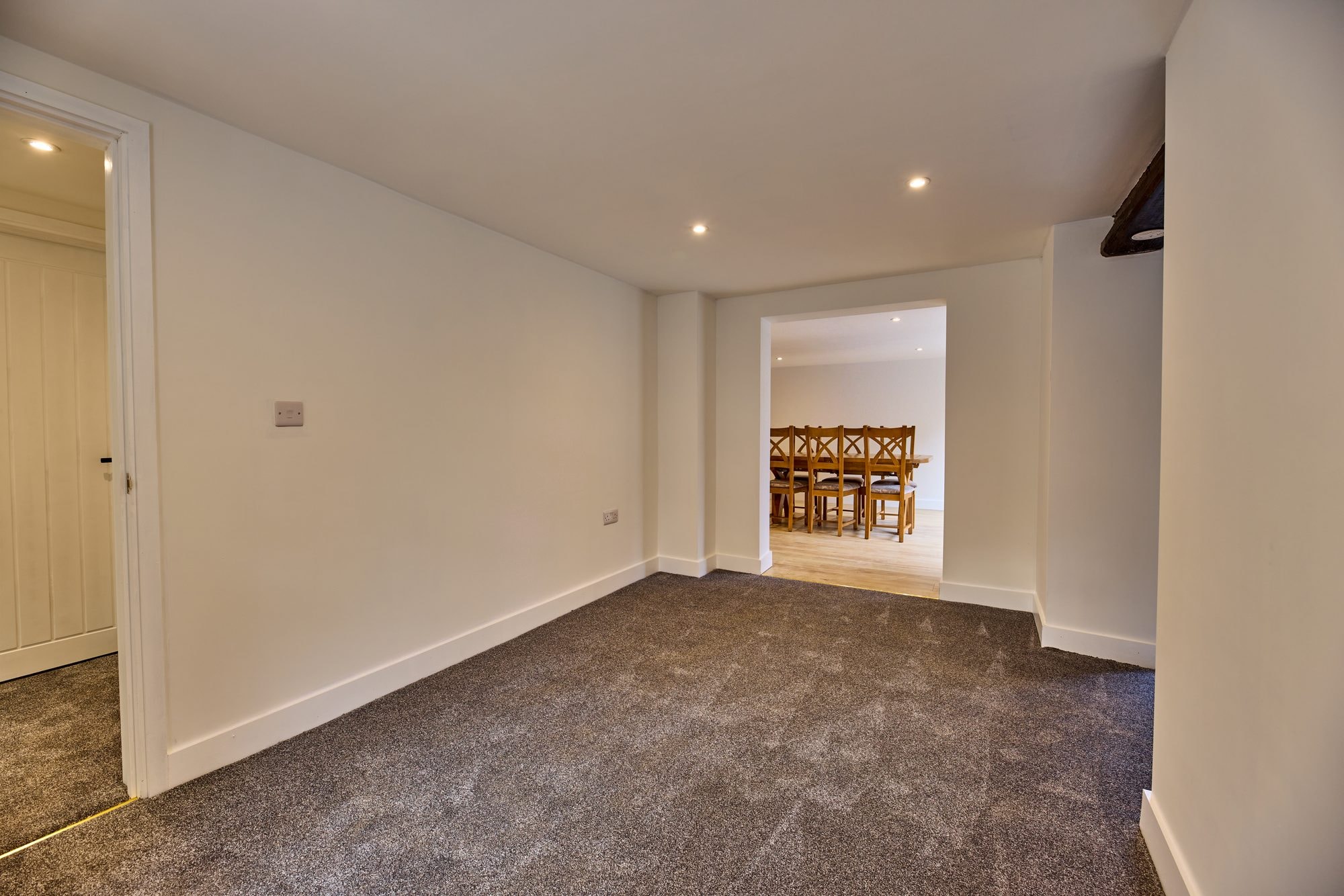 The renovated hallway, staircase and living rooms at the Old Timber Cottage in Stevenage by DNR Build (5 of 10)
