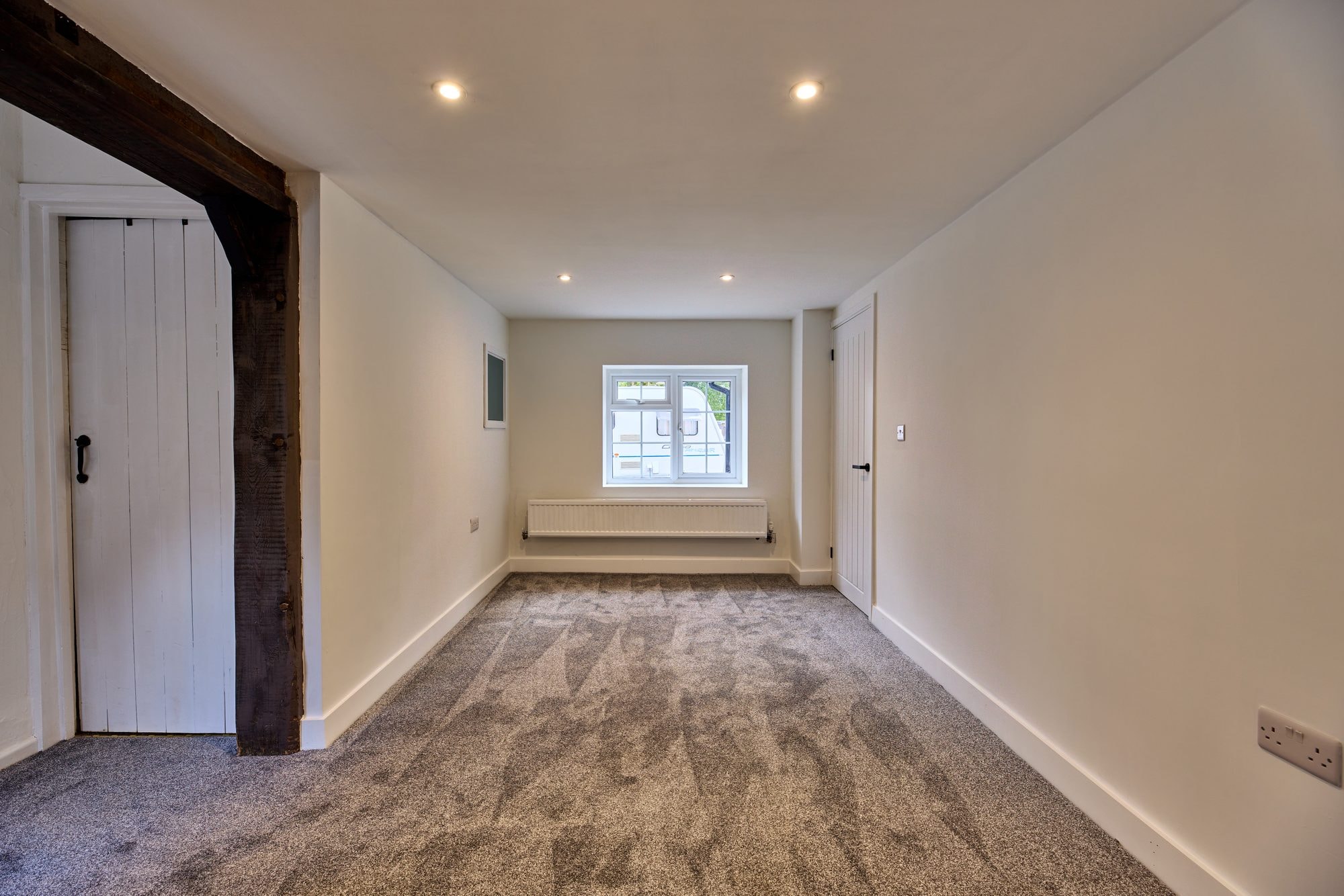 The renovated hallway, staircase and living rooms at the Old Timber Cottage in Stevenage by DNR Build (6 of 10)
