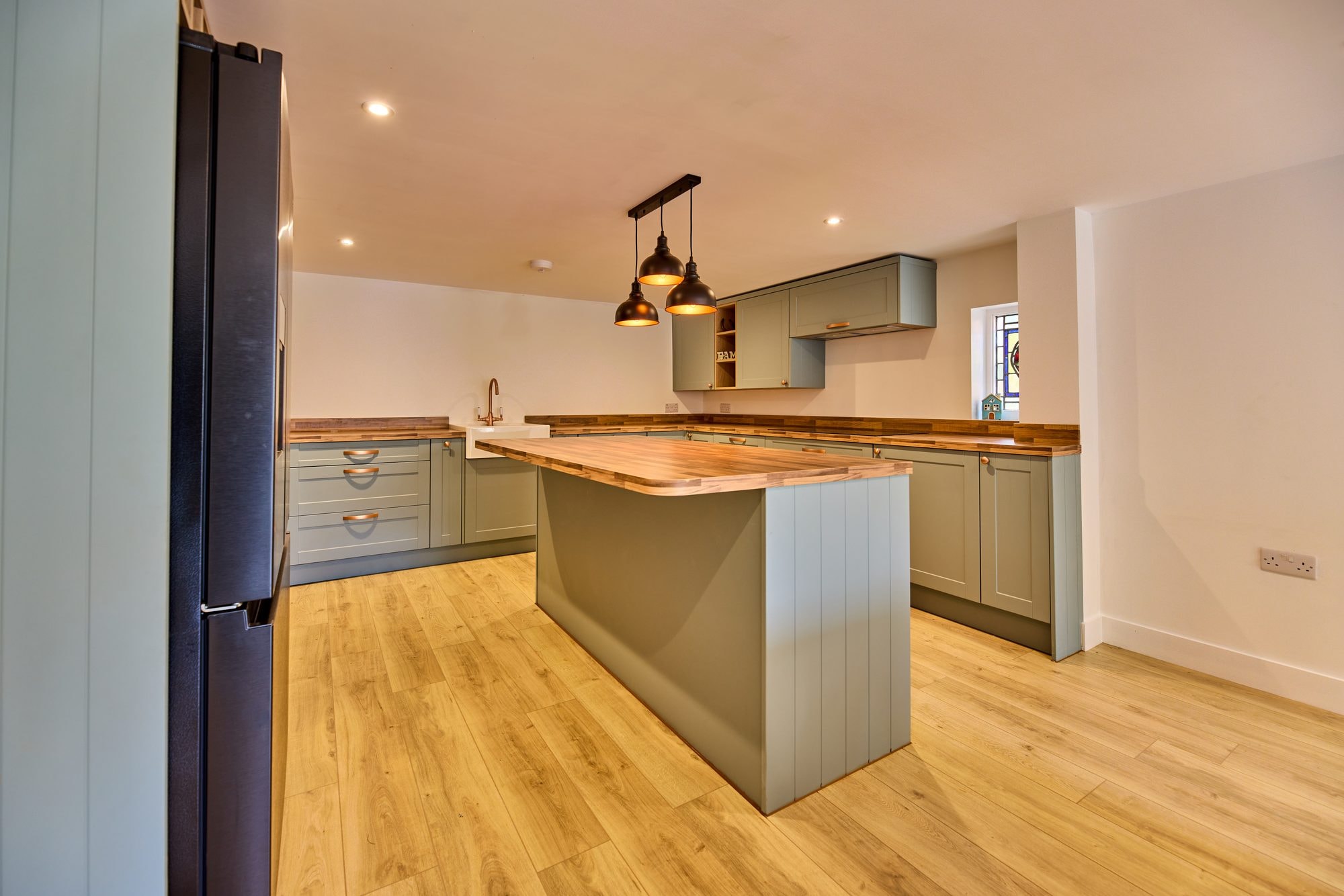 The new open plan kitchen and dining room at the Old Timber Cottage in Stevenage by DNR Build (3 of 10)