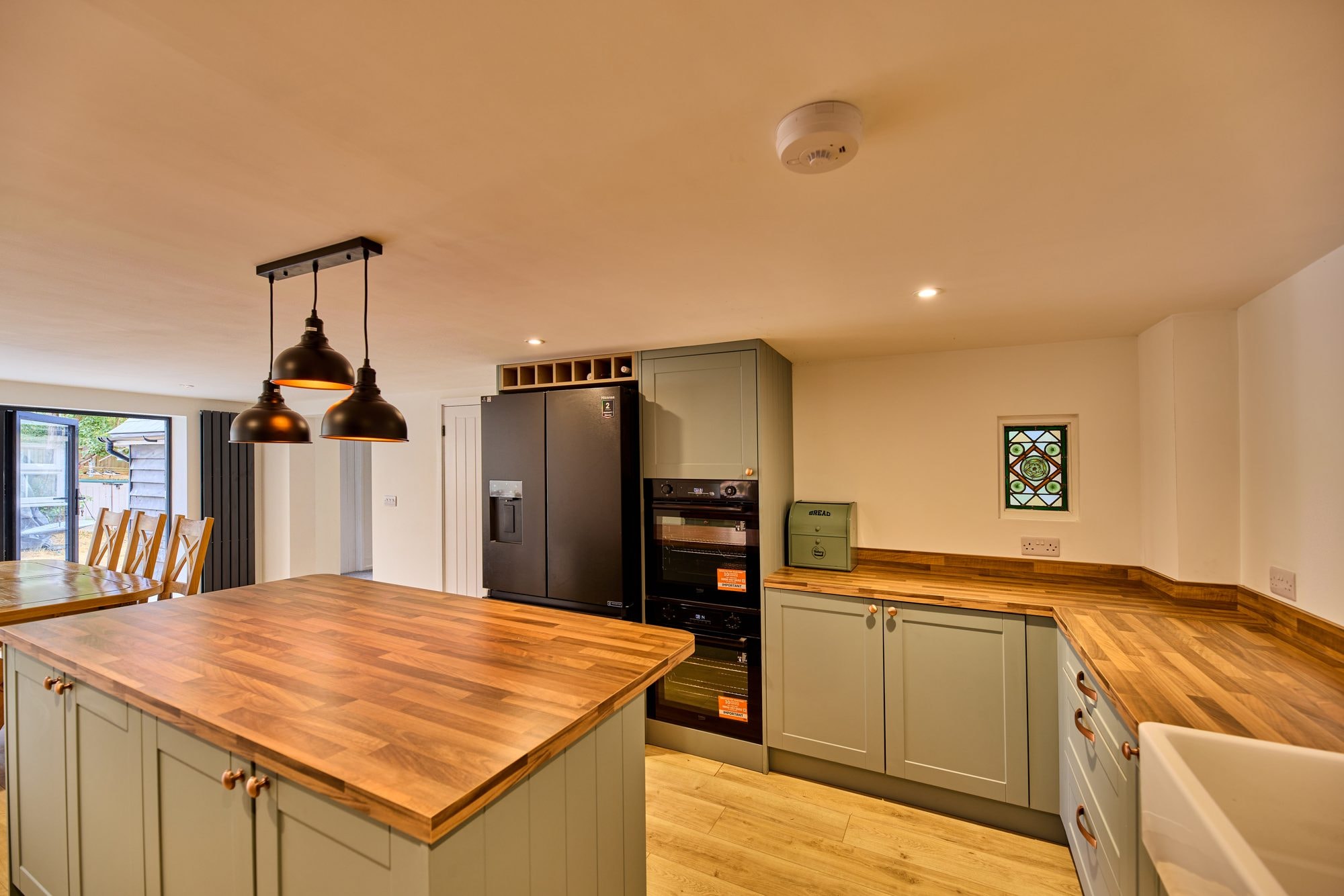 The new open plan kitchen and dining room at the Old Timber Cottage in Stevenage by DNR Build (6 of 10)