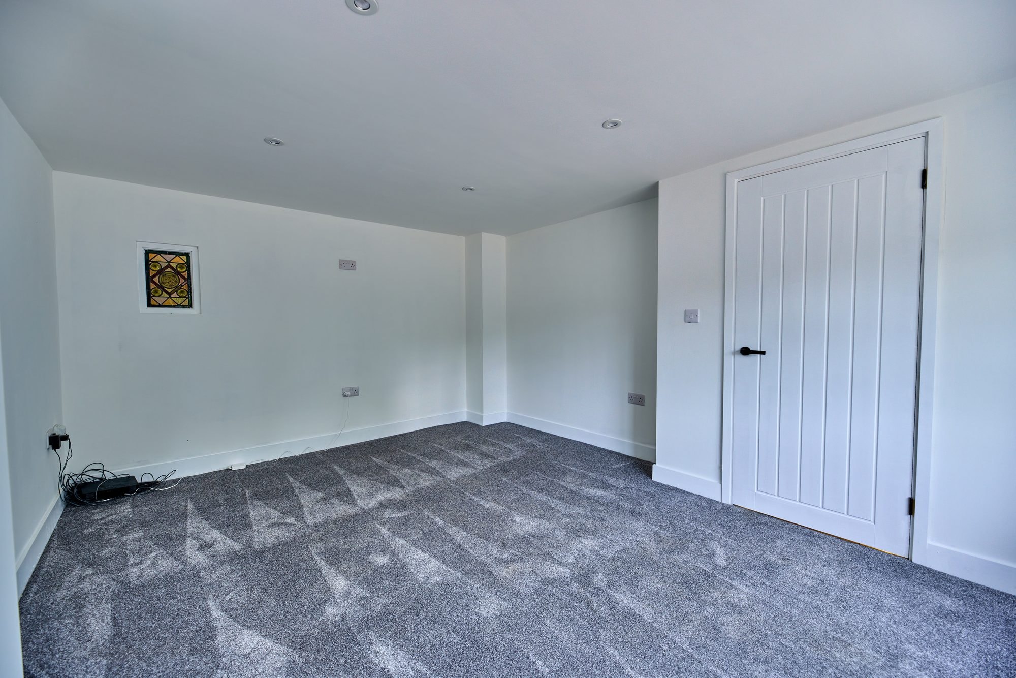 The renovated hallway, staircase and living rooms at the Old Timber Cottage in Stevenage by DNR Build (9 of 10)