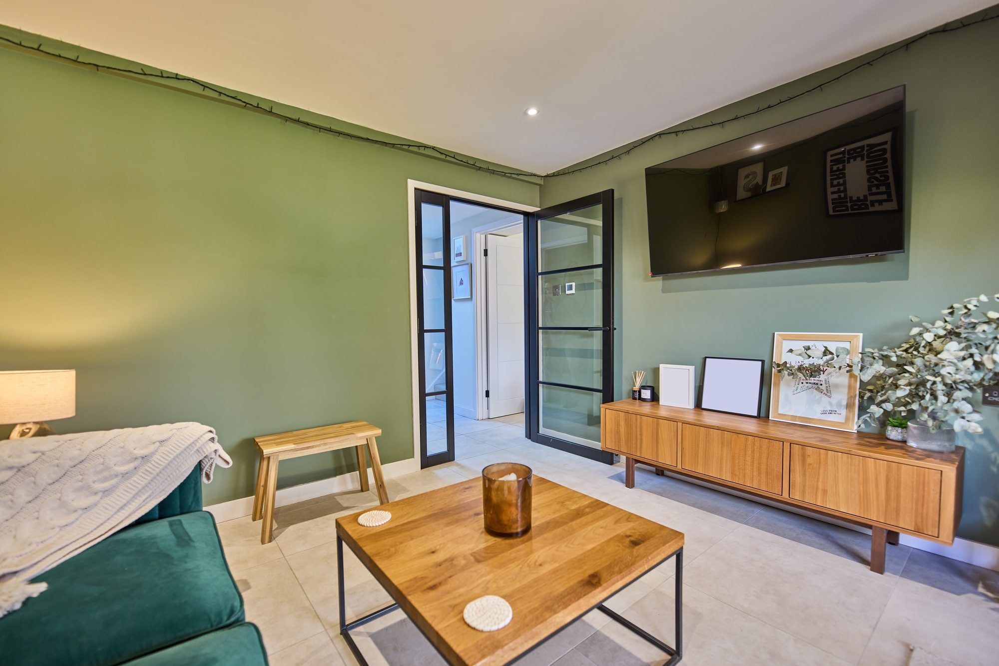 The finished snug, living room and bright hallway with a new rooflight at the Stevenage home by DNR Build (4 of 8)