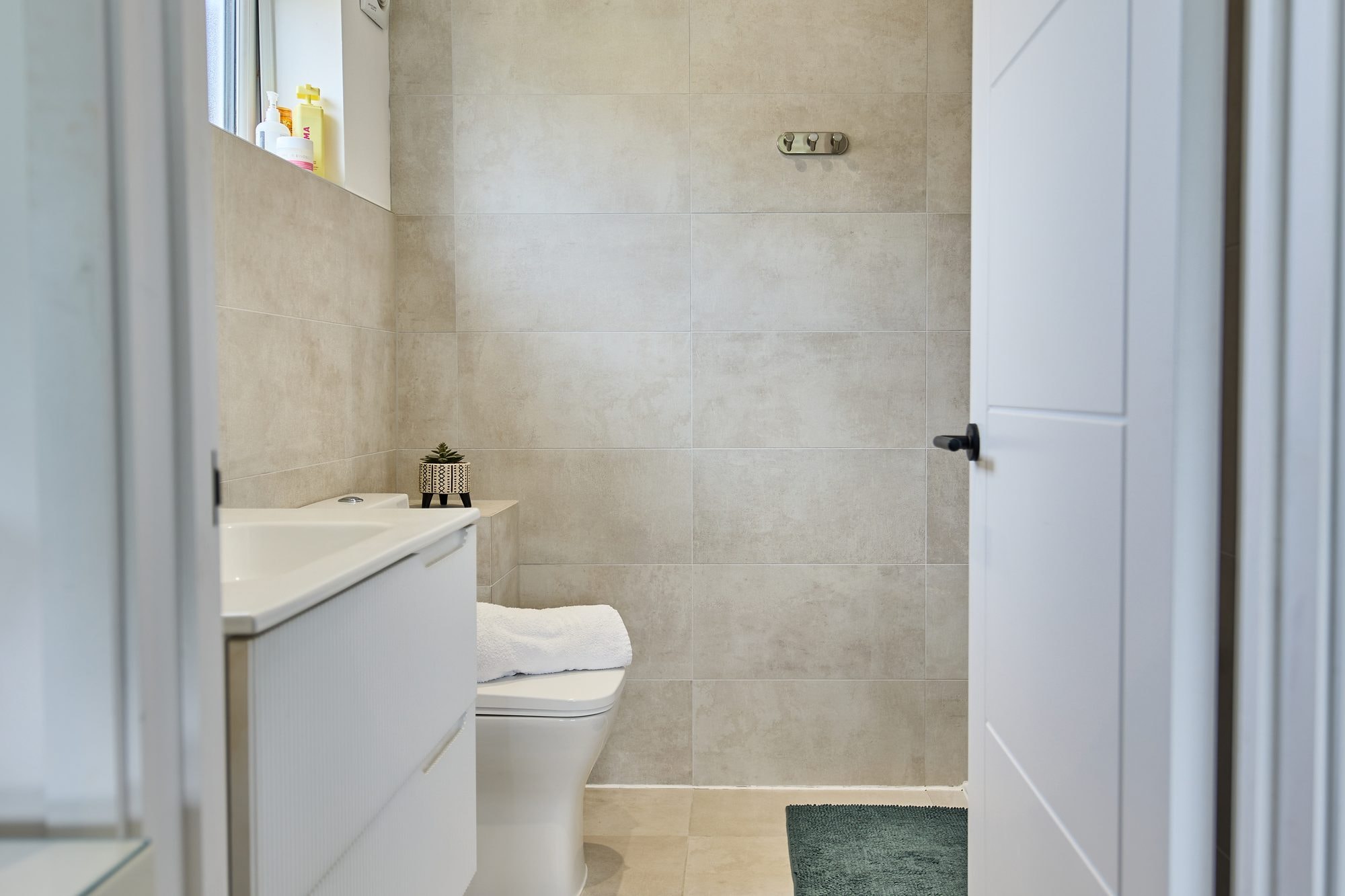 The finished bathrooms, cloakroom and utility room at the Stevenage home by DNR Build (7 of 13)