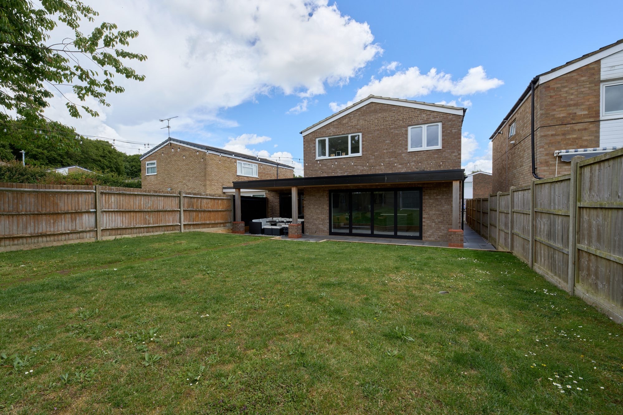 The finished cedar canopy, patio, garden and frontage at the Stevenage home by DNR Build (2 of 15)