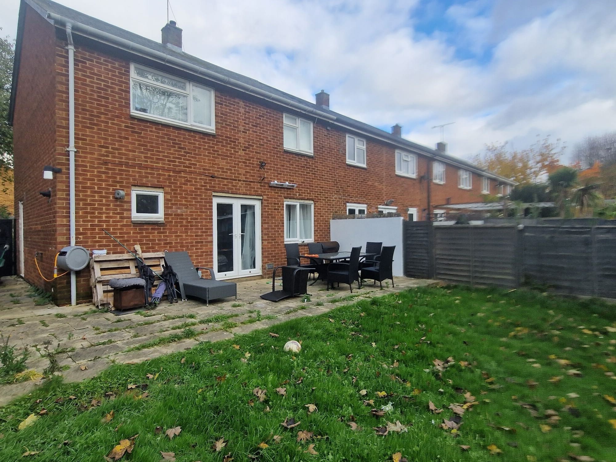 The existing rear elevation and patio before work began on the single storey extension by DNR Build