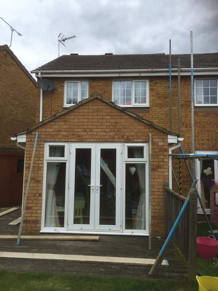 Scaffolding going up around the single storey extension ready to add the new first floor by DNR Build