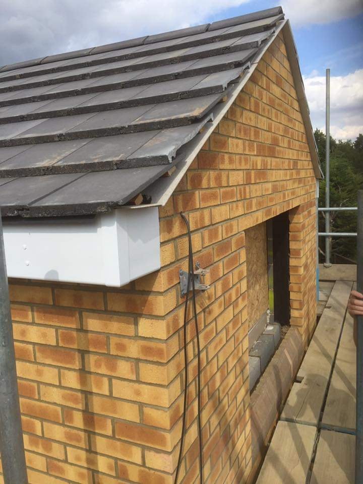 The finished tiled gable roof and matched brickwork on the new upper storey extension by DNR Build